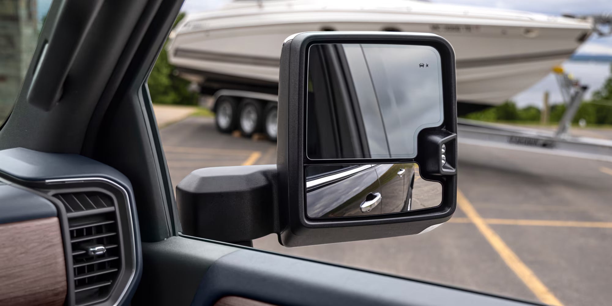 the passenger side mirror of a 2025 chevrolet silveraod hd truck