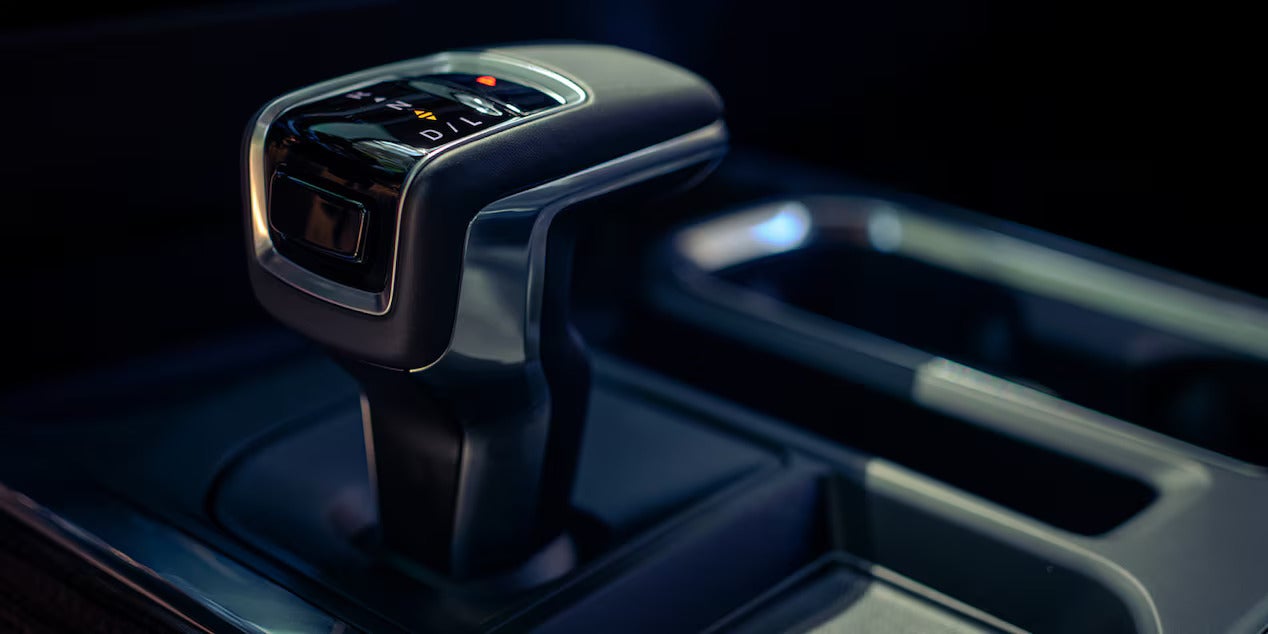 Close-up of the gear shift lever in the 2025 Chevrolet Silverado, highlighting interior design and functionality.
