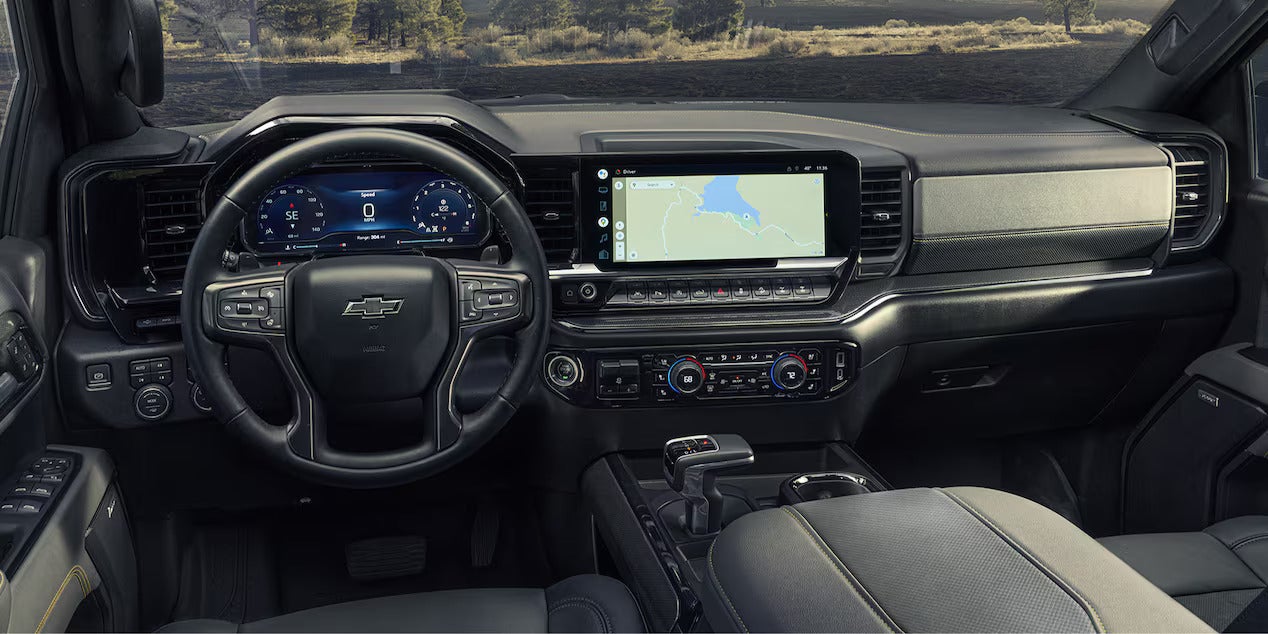Interior dashboard of the 2025 Chevrolet Silverado showcasing advanced technology features, including a digital display and touchscreen navigation.
